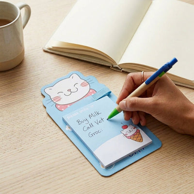 Bloc-notes magnétique kawaii en forme de chat avec stylo inclus. Feuilles 9×7 cm, 6 designs. Idéal pour frigo, casier ou bureau. Livraison en Tunisie.